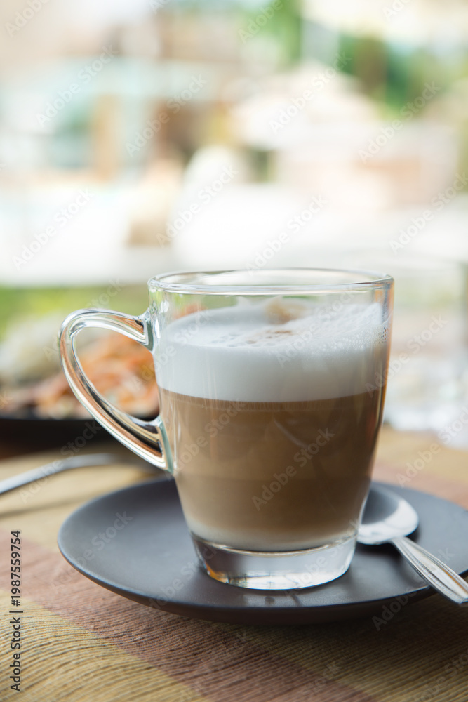 custom made wallpaper toronto digitalTransparent glass cup of coffee latte on table in the restaurant.