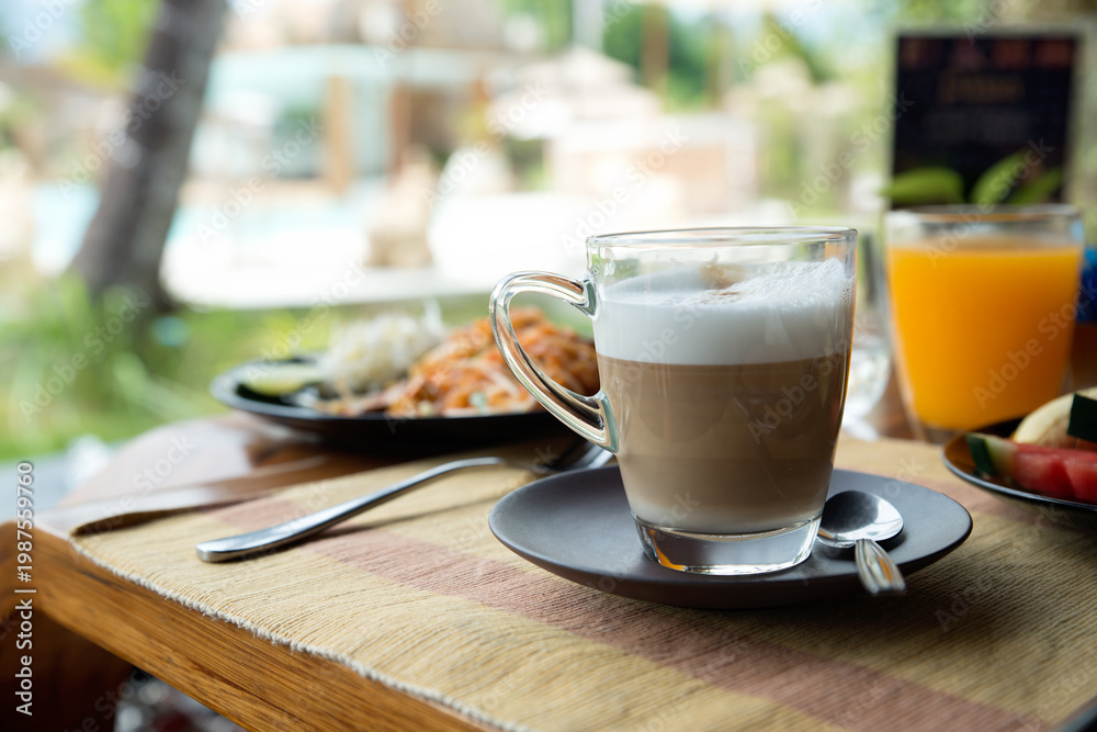 custom made wallpaper toronto digitalTransparent glass cup of coffee latte on table in the restaurant. Copy space