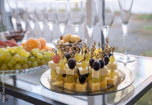 Wallpaper Mural Party appetizer with grape and cheese. Serving snacks at a party. Selective focus. Torontodigital.ca