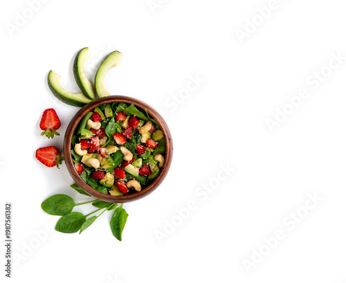 Wallpaper Mural Healthy veggie salad with avocado, arugula, spinach, strawberries, cashews and seeds low carb, low calorie diet. Healthy eating, nutrition and diet concept. Top view, flat lay Torontodigital.ca