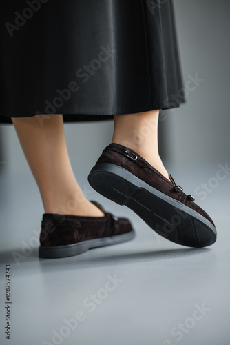 Wallpaper Mural Feet In Black Loafers With Leather Handbag On Studio Floor, Polished Office Styling With Classic Tassel Detail Torontodigital.ca