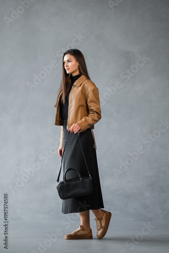 Wallpaper Mural Stylish Woman In Modern Attire. Female Model Showcasing Ecofriendly Casual Wear In Profile View Torontodigital.ca