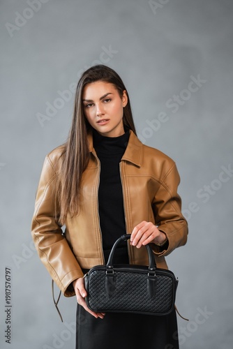 Wallpaper Mural Woman Entrepreneur Presenting Sophisticated Style Through Polished Leather Accents And Confident Gaze Torontodigital.ca