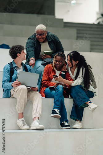 Canvas Print Diverse students collaborating and learning on university campus, using technolo