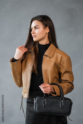 Wallpaper Mural Elegant Woman With Woven Purse. Caucasian Woman Captures Lifestyle Vibe With Woven Bag Expression Torontodigital.ca