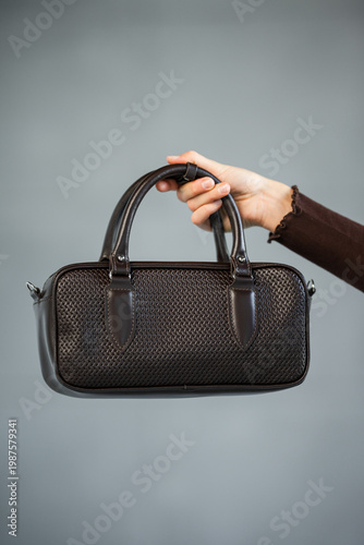 Wallpaper Mural Elegant Leather Purse Against Background. Stylish Leather Handbag With Polished Handles Showcased Torontodigital.ca