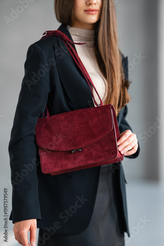 Wallpaper Mural Caucasian Woman Fashion Buyer With Maroon Suede Shoulder Bag, Cropped Frame Highlighting Texture And Strap, Torontodigital.ca