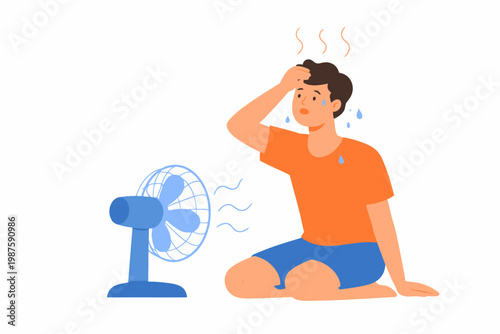 Caucasian young male overheating next to electric fan in summer heat