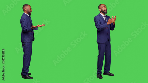 Billede på lærred African american worker fighting and having argument on camera, feeling displeased and furious over full body green screen
