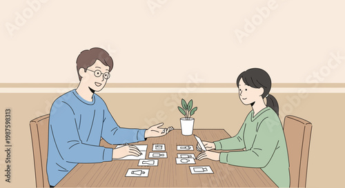 Couple playing board game at table, enjoying leisure time at home