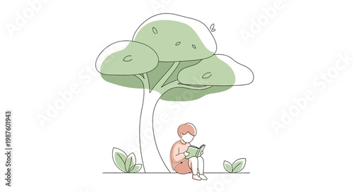 Person sitting under a tree reading.