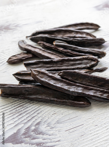Close-up of Dried Carob Pods on Table
