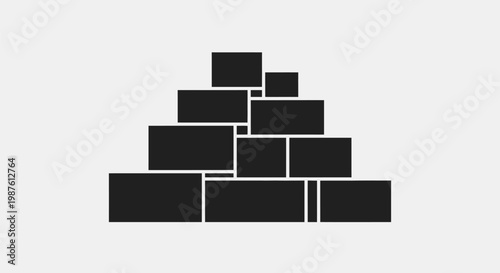 Black bricks stacked in pyramid shape.