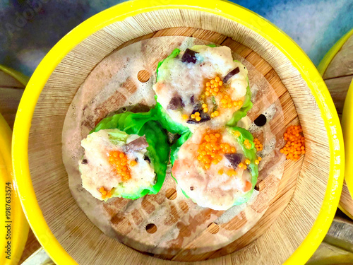 Chinese Siew Mai shrimp and pork steamed dumplings Dim Sum with fish roe garnish