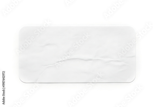 Crumpled blank white paper label on white background