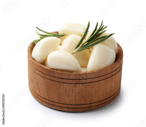 Tableau sur toile Pickled garlic in bowl and rosemary isolated on white