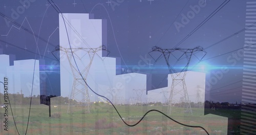 Dominating transmission towers stretching across field at outskirts, with power lines, data overlay