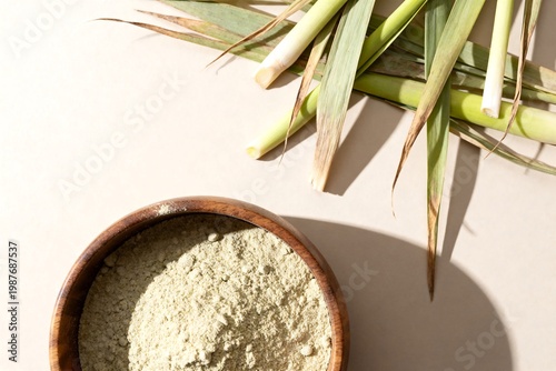 Kaffir Lime Leaves and Lemongrass Powder in Wooden Bowl, Top View