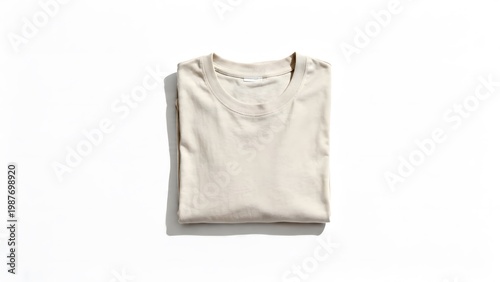 Folded blank t-shirt mockup with clean fabric texture, isolated on white background