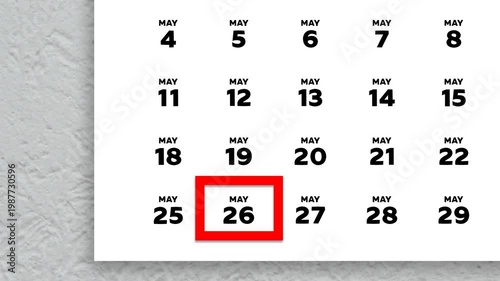The date May 26th marked with a red cursor on the wall calendar 2026