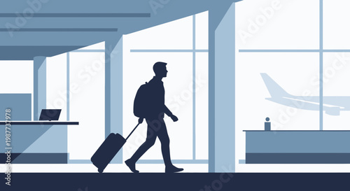 Man walking with luggage at airport.