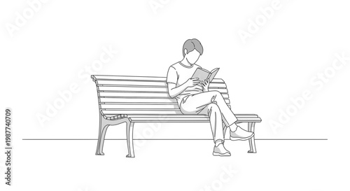 Man sitting on a bench reading.