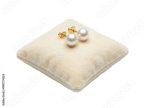 Canvas Print Elegant round white pearl stud earrings with gold posts resting on a soft cream