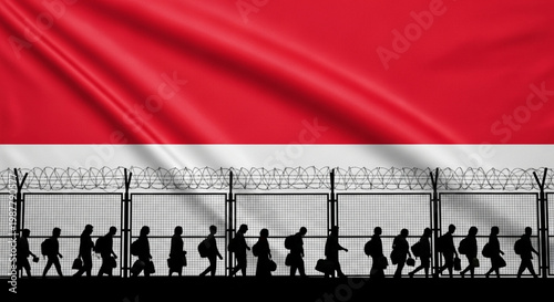 Immigration and border control in Indonesia with silhouettes of people crossing a border fence under the Indonesian flag
