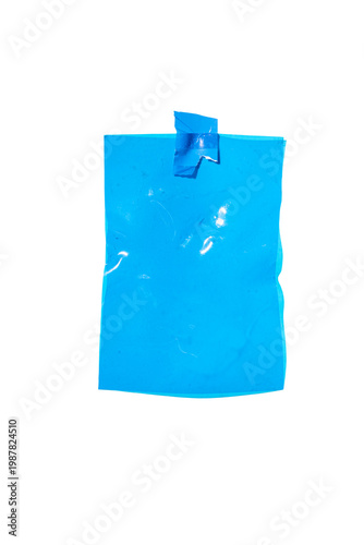 Blank blue crumpled plastic film sheet attached to clean background with tape, providing copy space