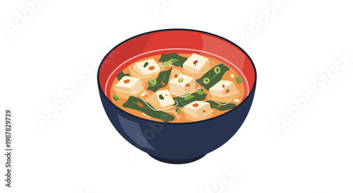 Traditional bowl of Japanese miso soup containing cubes of tofu and green seaweed in a warm savory broth served in a black and red lacquerware bowl.