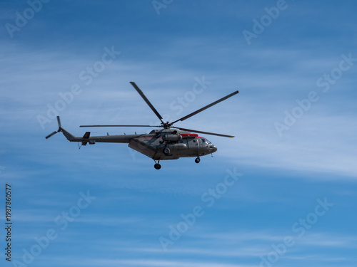 Quadro em tela Mi-8 helicopter flying against blue sky aviation transport aerial vehicle clear weather and open air flight