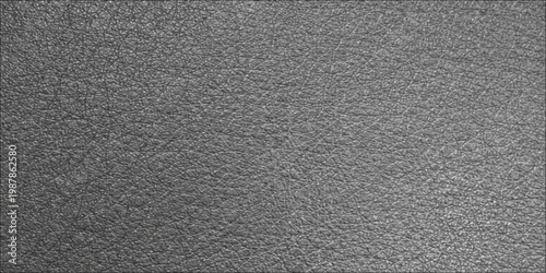A closeup of dark black leather fabric material showing a rough textured surface and detailed pattern for an old wallpaper background