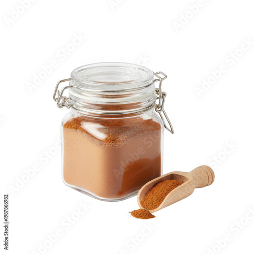 Glass jar with cinnamon powder and wooden scoop isolated on a transparent background