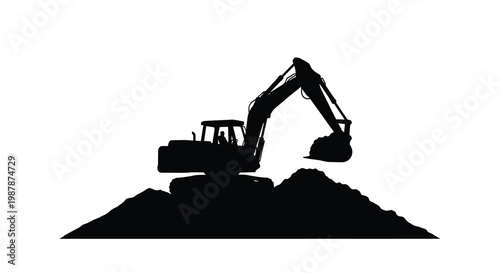 Black excavator working on a mound distinctively shown as a silhouette