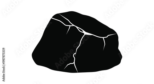 A dark fractured rock formation presented as a striking silhouette