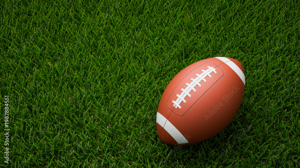 Obraz premium American football ball on a green grass field background