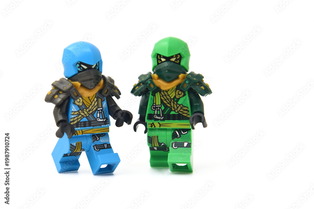 Fototapeta premium Editorial illustrative image of two lego ninjago minifigures green ninja Lloyd and blue Jay isolated on white.