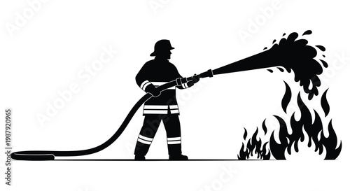 Firefighter aiming hose at flames dramatic black silhouette