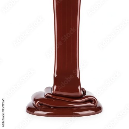 A close-up view of a rich, dark chocolate sauce flowing from a bottle.
