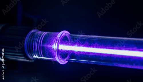 A close-up of a glass tube with glowing purple light inside.