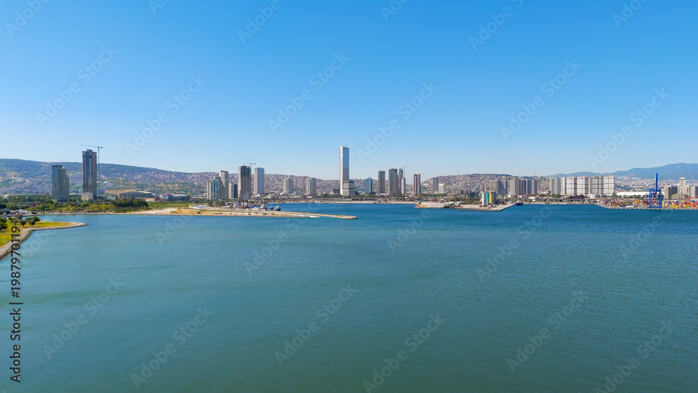 Fototapeta premium Izmir, Turkey.Panoramic aerial view of the Izmir bay and the modern city skyline with skyscrapers in Bayrakli district on a sunny summer day. Aerial view.