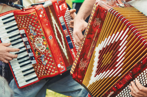 Close-Up of Red Accordion Players in Folk Performance