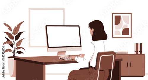 woman sitting at desk with laptop.