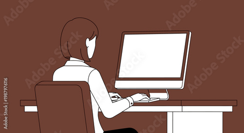 woman sitting at desk with computer.