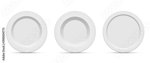 Three pristine white plates with simple, elegant designs stand side-by-side