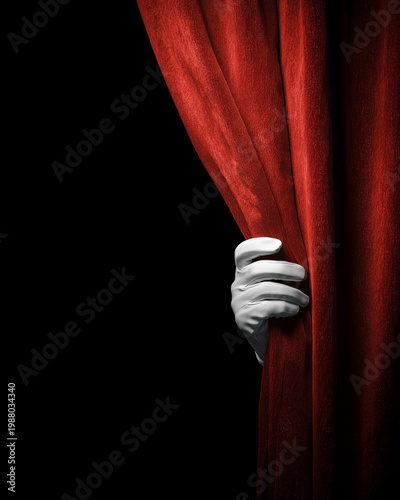 Hand holding a red curtain