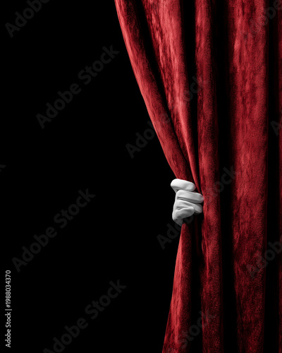 Hand holding a red curtain