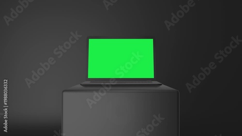A modern laptop with a green screen sits on a black pedestal against a dark background, perfect for design and tech presentations.