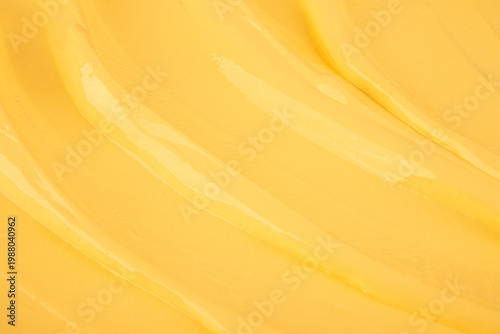 Delicate texture of custard banana cream with soft waves. confectionery background. layout for design. Top view. A copy space.