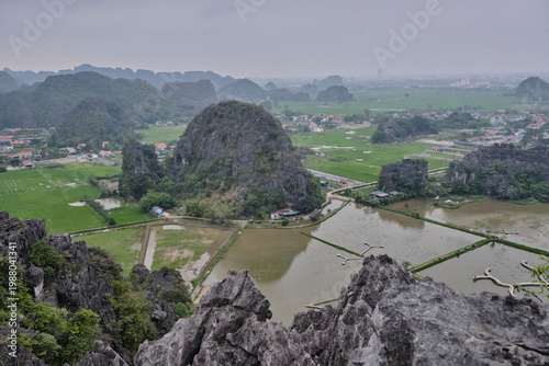 The winding Ngo Dong River with rice fields in a karst valley, Ninh Binh